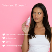 Model holding Lash Therapy Australia hair boosting serum to improve hair density and scalp health